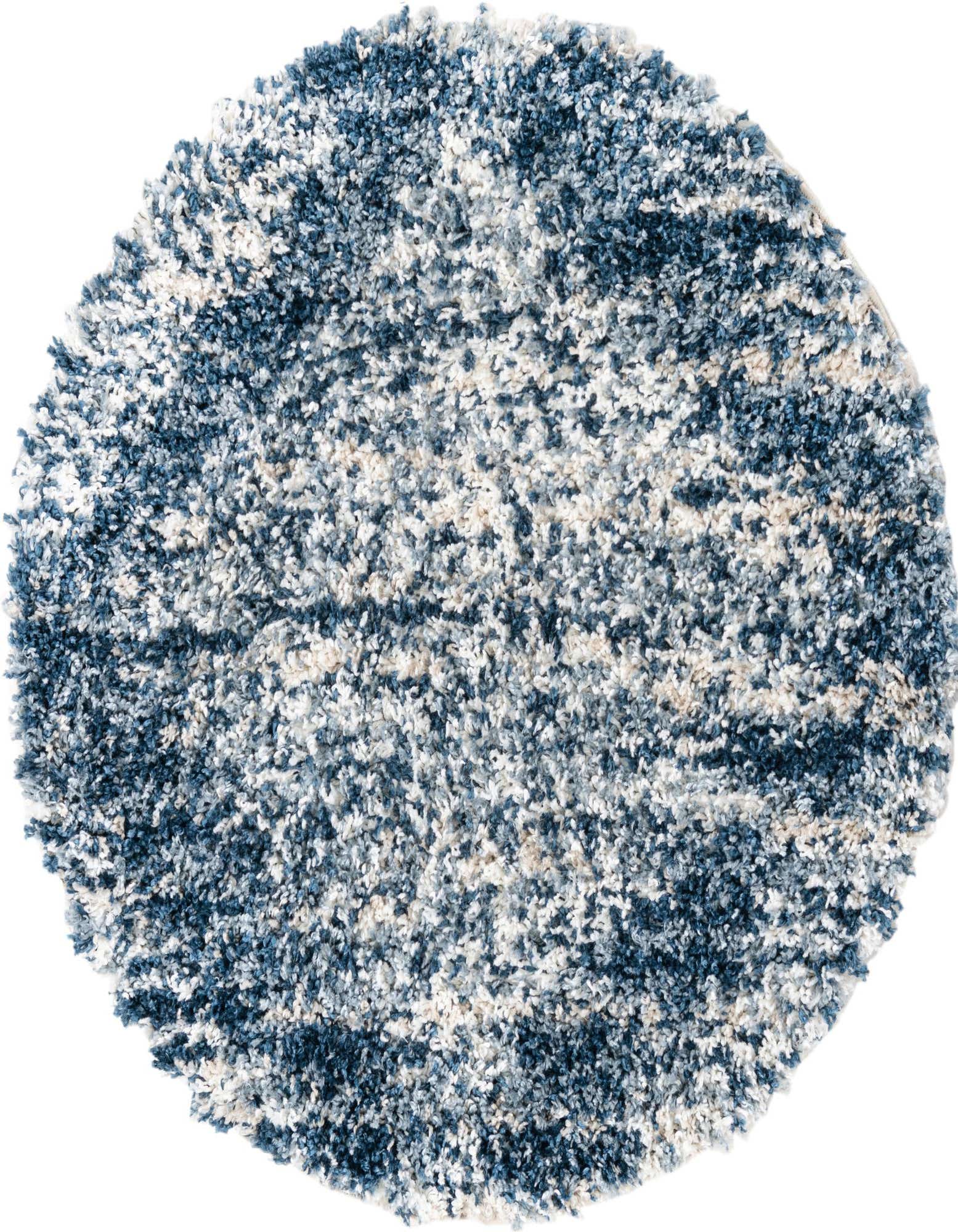 A round, plush shag rug featuring a mottled pattern of various blue, white, and beige tones, perfect for a cozy living space.
