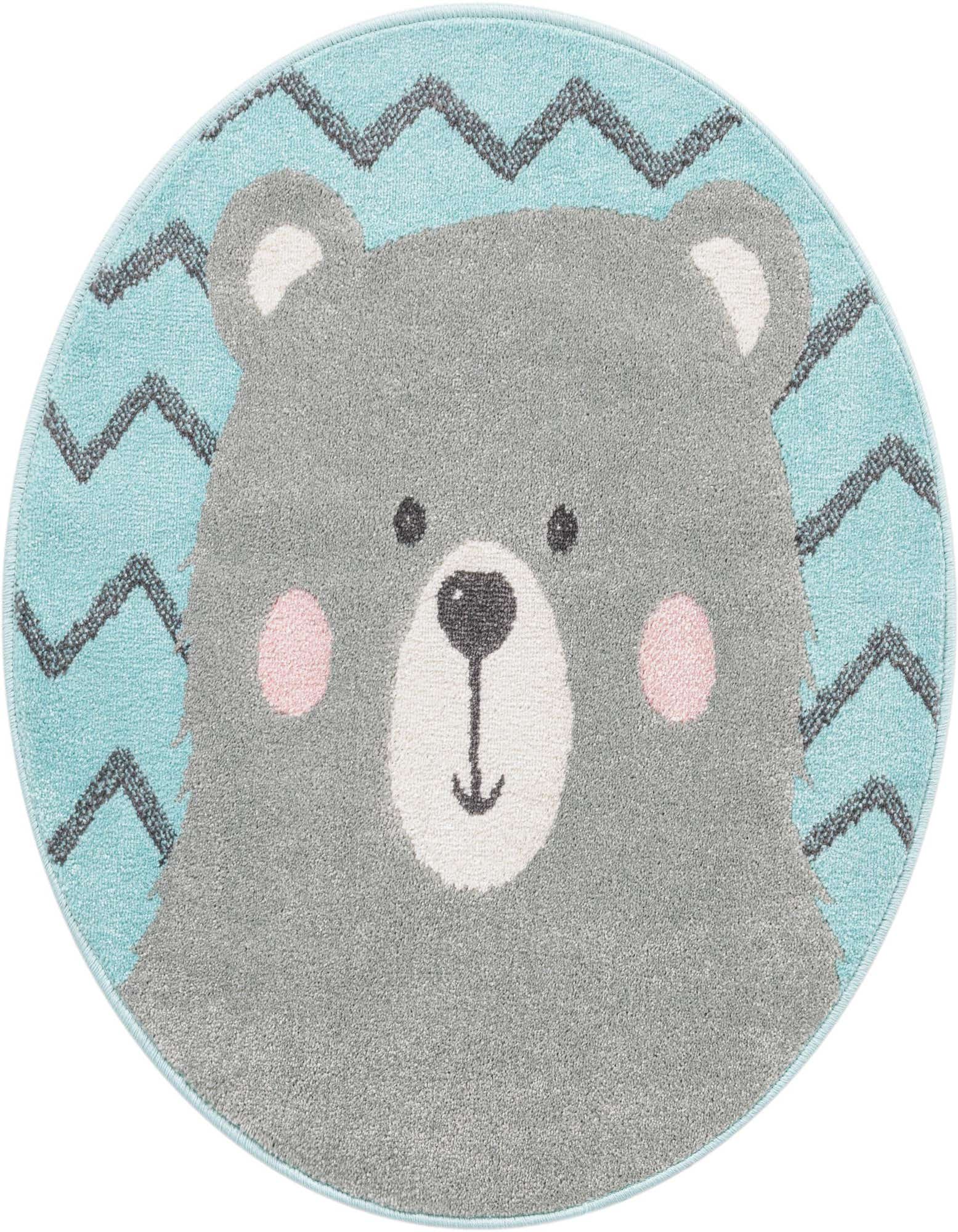 A round blue rug featuring a cute grey bear face with pink cheeks and a black zigzag pattern.