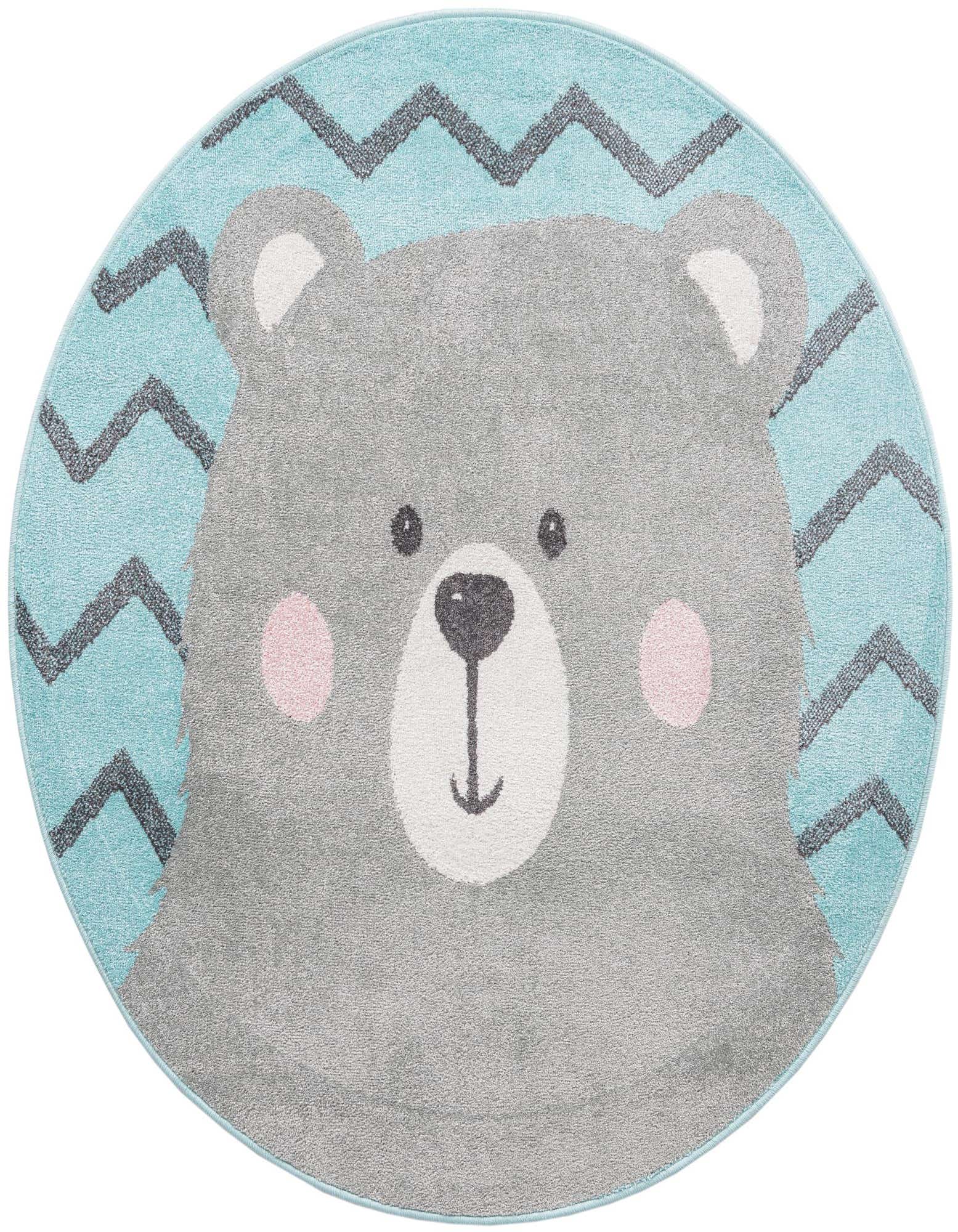A round blue rug featuring a large, friendly gray bear face with pink cheeks and white snout, set against a blue background with dark chevron patterns.