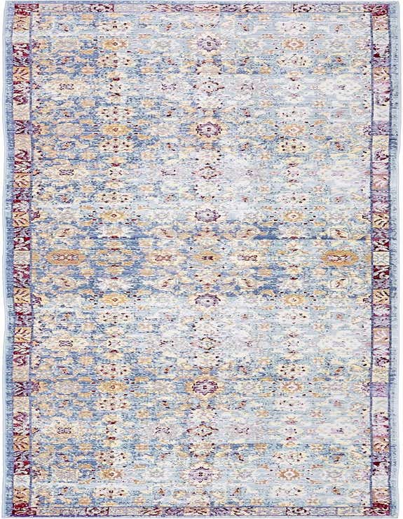 A 10 ft runner rug in shades of blue, cream, and gold with a distressed bohemian floral pattern, ideal for a hallway.