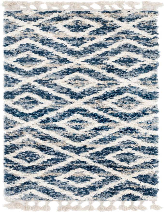 A 6 ft runner rug from the Athena Shag collection, featuring a textured blue and white abstract pattern with tassels.