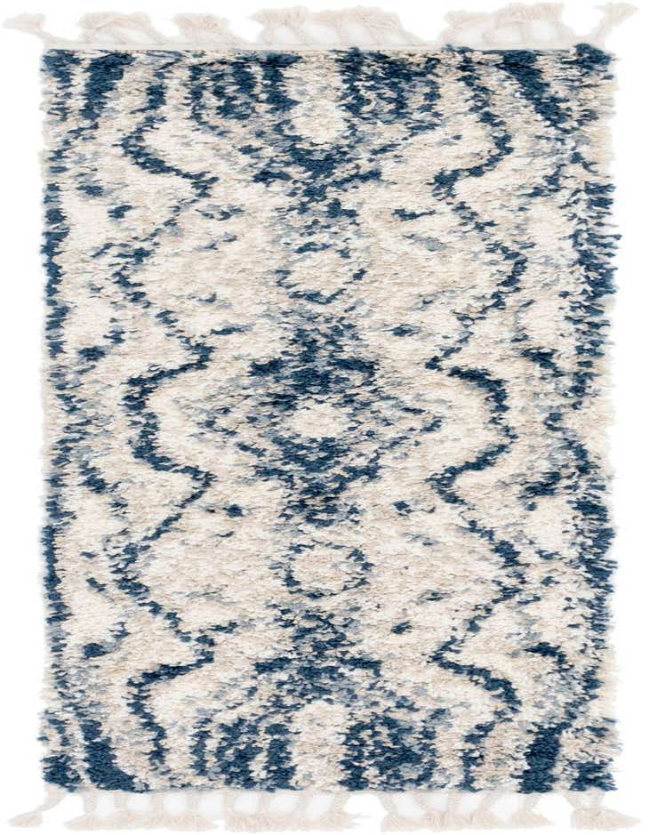 A 6 ft runner rug from the Athena Shag collection, featuring a plush blue and cream abstract pattern with tassels.