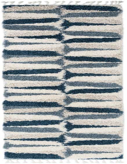 A 12 ft runner rug from the Athena Shag collection, featuring a modern abstract pattern in varying shades of blue and cream, with a plush shag pile and decorative tassels.