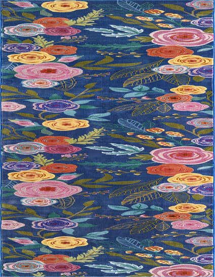 A 10 ft runner rug with a vibrant modern floral pattern on a deep blue background, featuring large pink, yellow, orange, and purple flowers with green leaves.