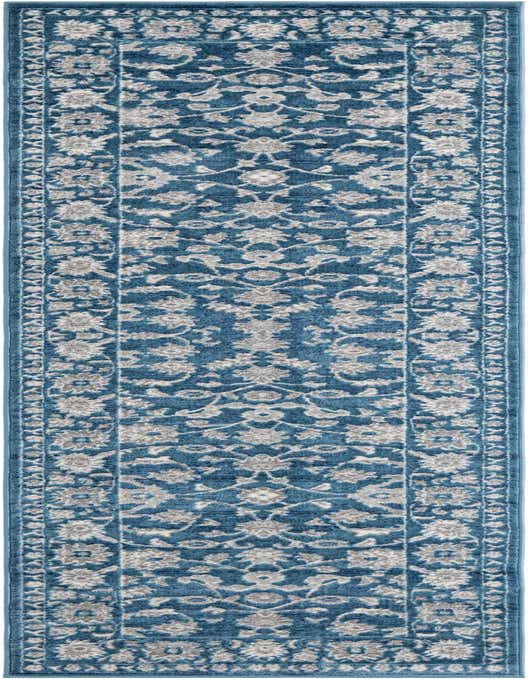 A long 10 ft runner rug in shades of blue with a traditional floral pattern and a decorative border.
