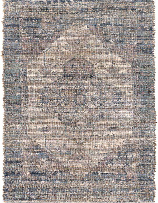 A handmade 8 ft runner rug featuring a faded blue and brown traditional medallion pattern, ideal for a hallway.