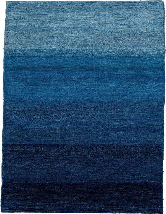 A 10 ft runner rug featuring an abstract, modern design with an ombre gradient from light blue to dark blue.
