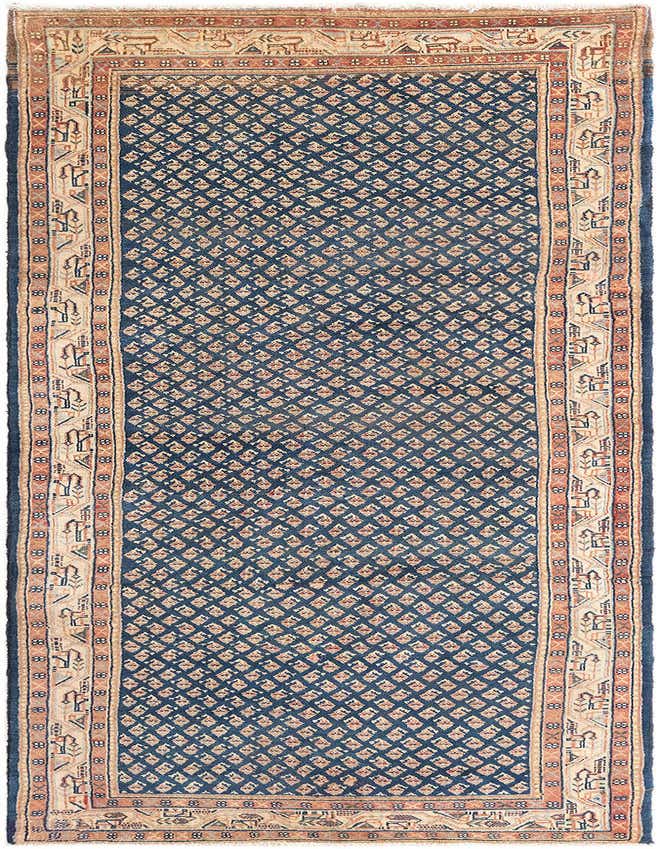 A 10 ft blue wool runner rug with a tribal diamond pattern and a cream and rust traditional border.