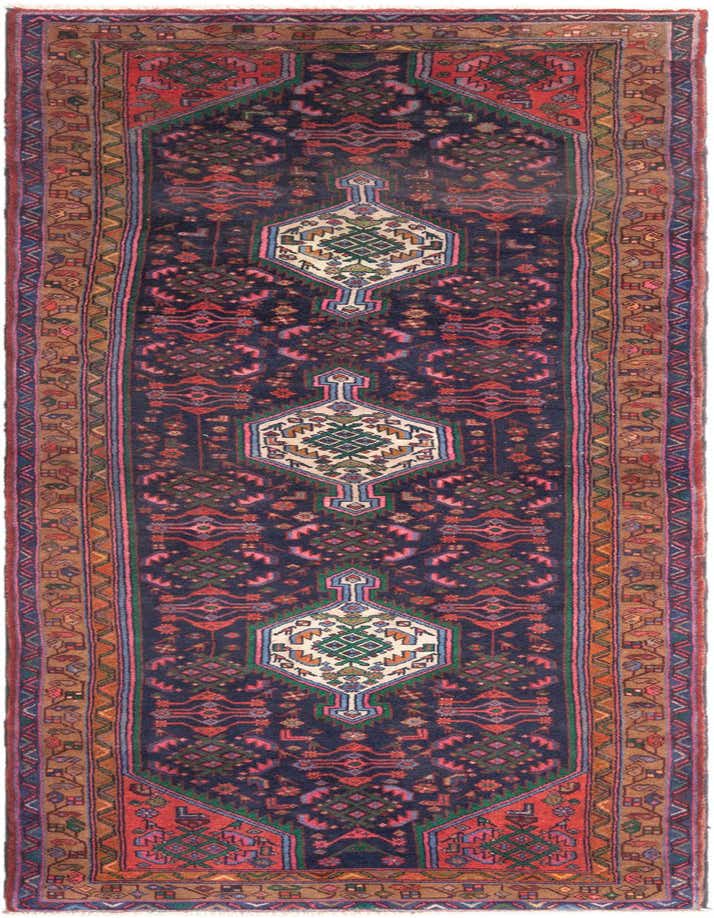 A 10 ft Hamedan runner rug in blues, featuring a traditional tribal pattern with geometric medallions and a multi-colored border, ideal for a hallway.