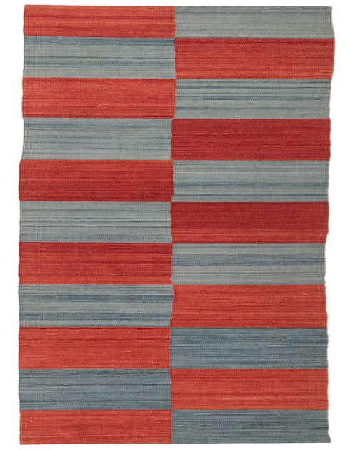 A 12 ft runner rug featuring a modern tribal pattern with alternating blocks of blue and red, flatweave texture.