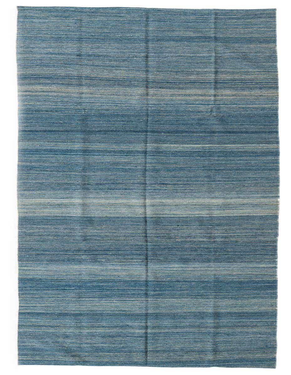 A long, flatweave Kilim Modern runner rug in varying shades of blue, perfect for a hallway.