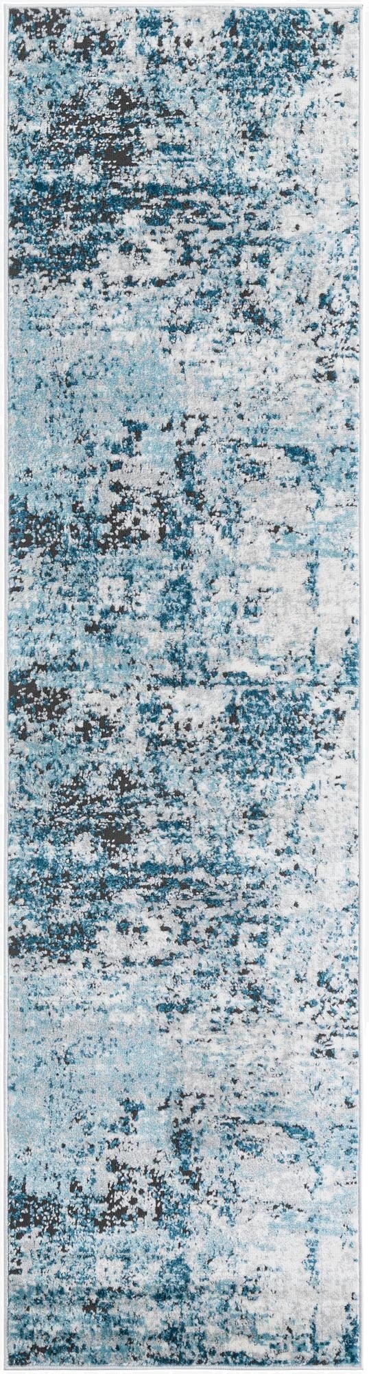 A long 8 ft runner rug with an abstract pattern in varying shades of blue, grey, and black, suitable for a hallway.