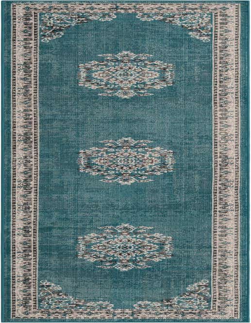 A 10 ft runner rug in a distressed teal blue with a vintage medallion and tribal border pattern in cream, gray, and black.