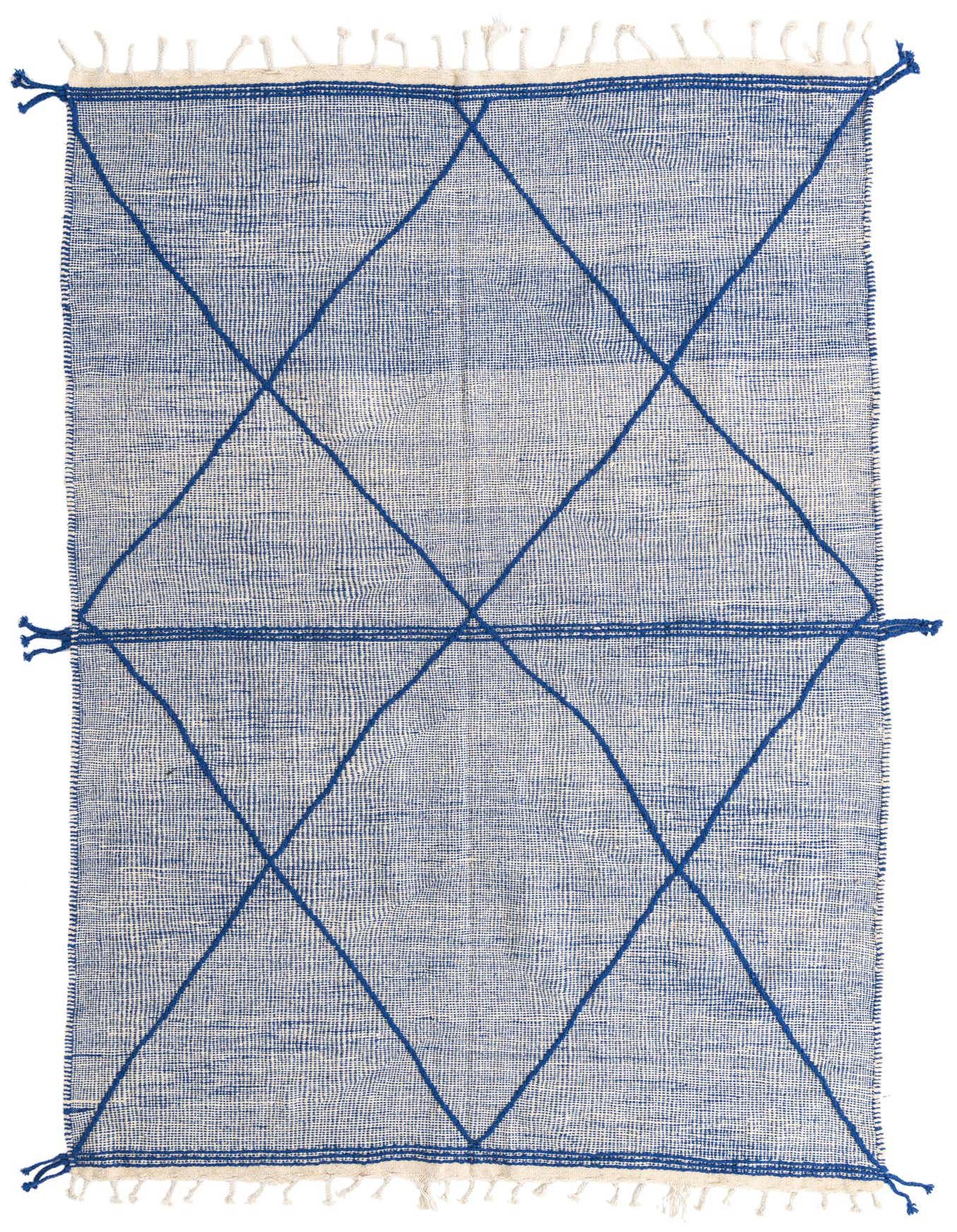 A 10 ft runner rug in blue and off-white, featuring a tribal geometric diamond pattern and shag pile.