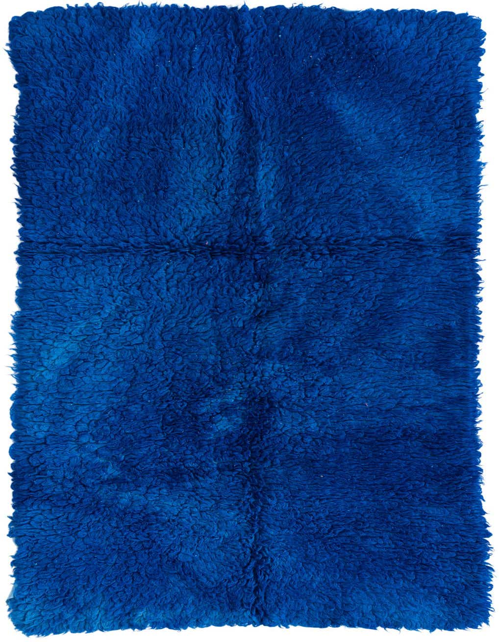 A plush, handmade 6 ft runner rug in a vibrant blue shag texture, perfect for hallways.