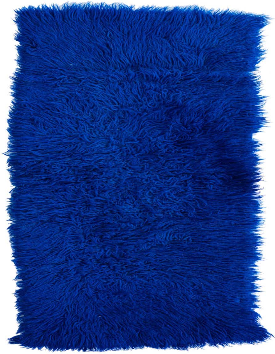 A vibrant blue 4 ft runner rug with a plush shag pile, perfect for adding a pop of color to a hallway.