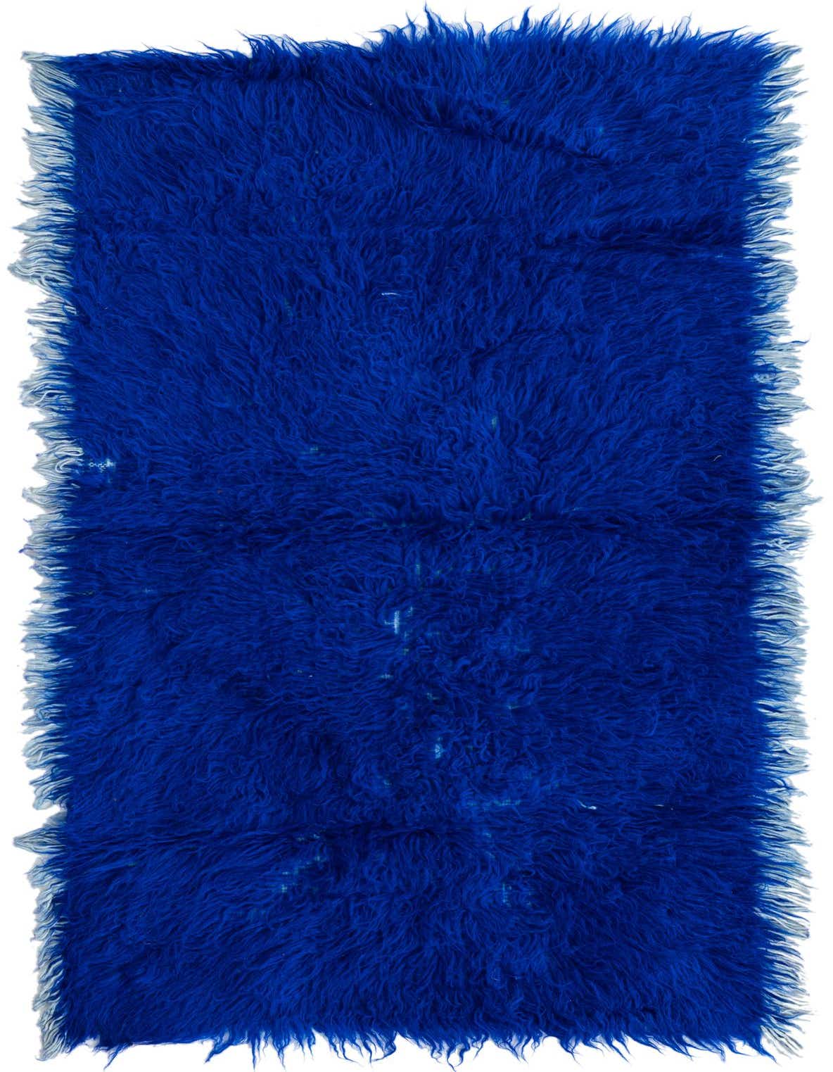 A vibrant blue 5 ft runner rug with a shaggy, high pile texture and fringed edges, ideal for a hallway.