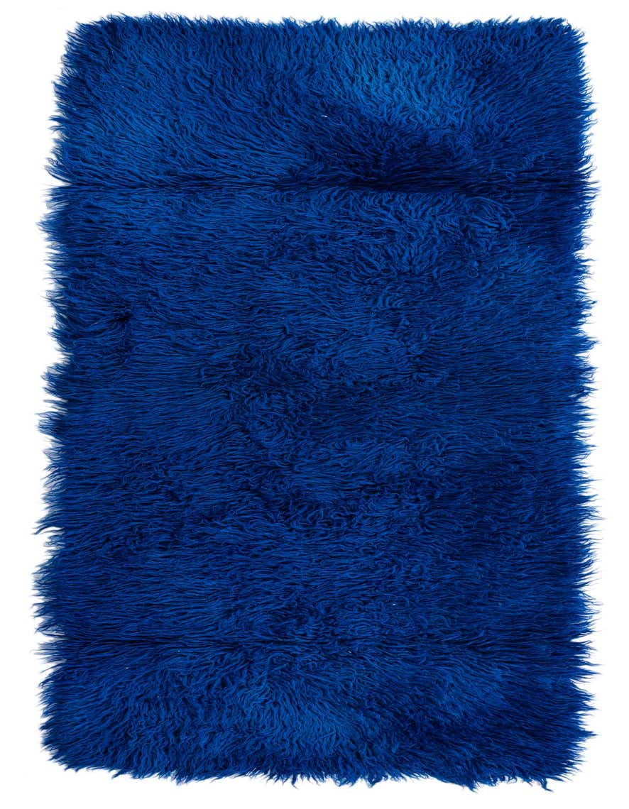 A vibrant blue shag runner rug, 7 ft long, with a plush, textured pile, perfect for a hallway.