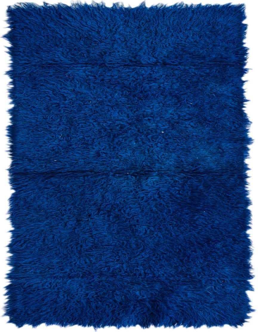 A plush, handmade 6 ft runner rug in a vibrant royal blue shag texture, perfect for hallways.