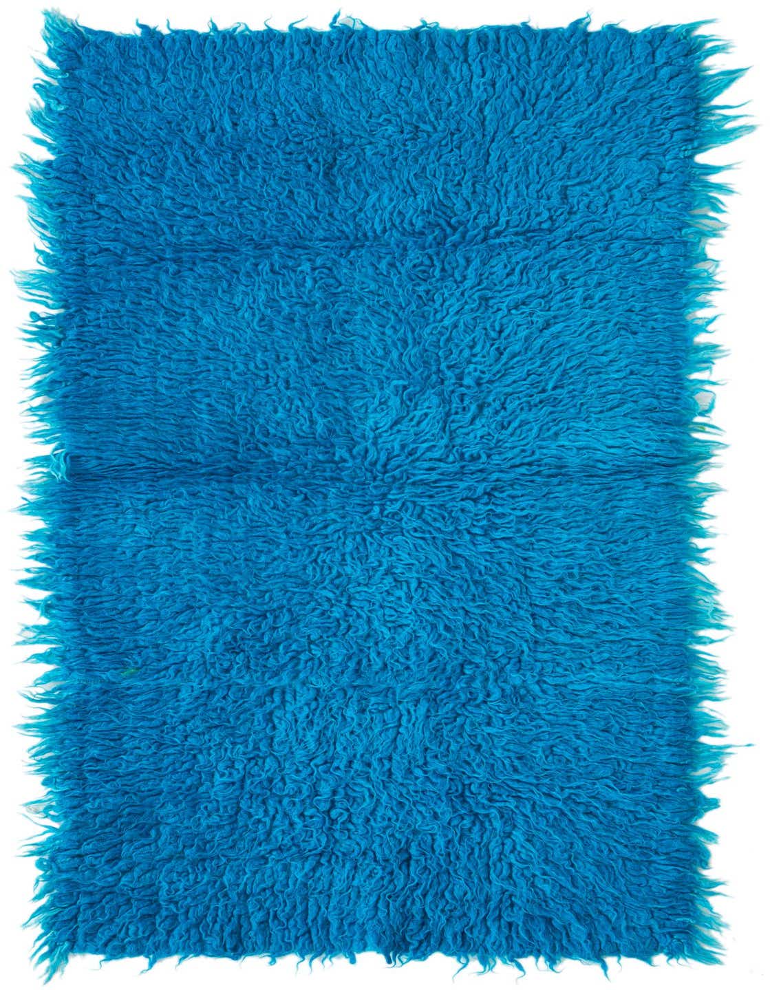 A vibrant blue 4 ft Moroccan shag runner rug, handmade from wool, with a plush, textured pile.