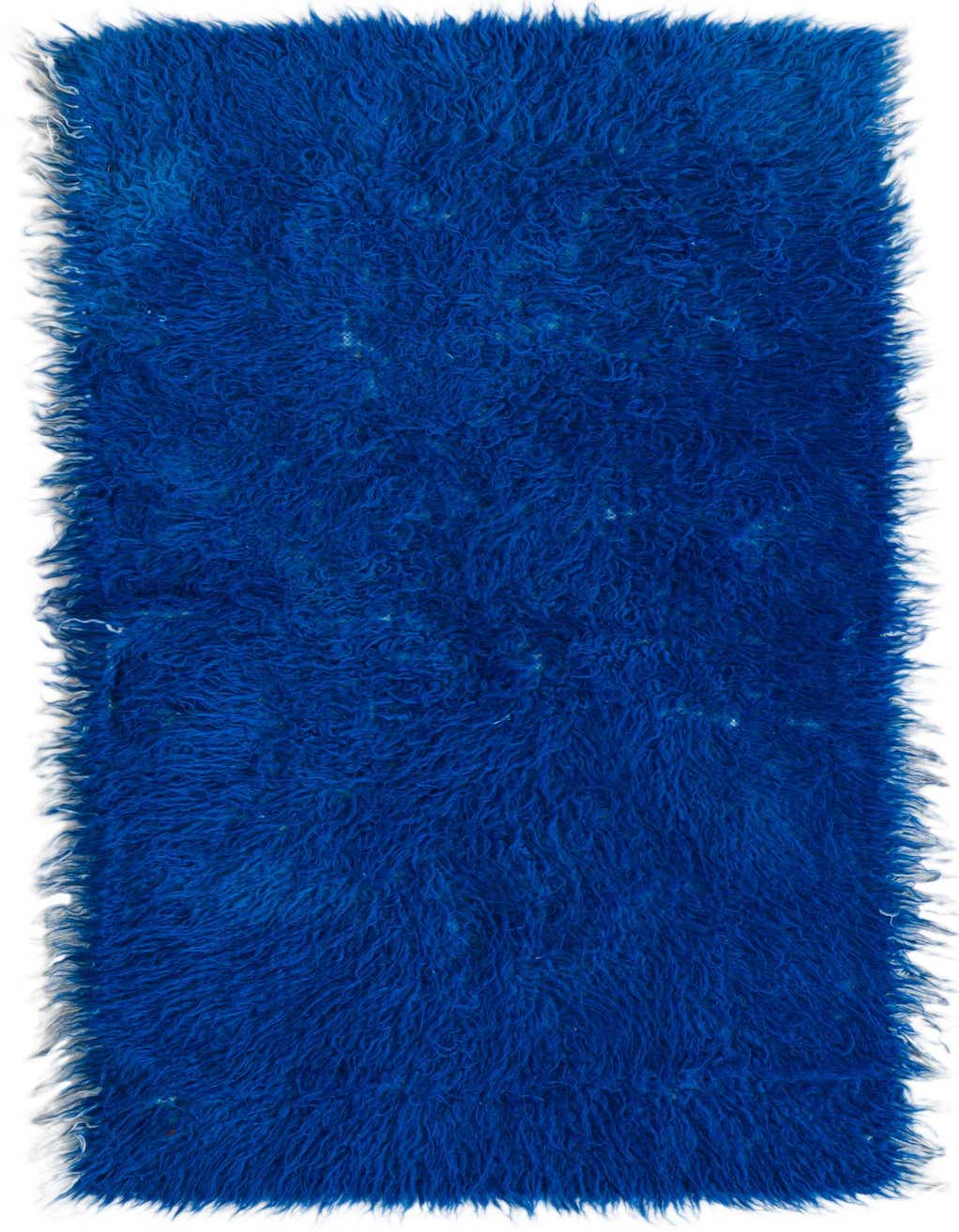 A vibrant blue 5 ft runner rug with a plush shag pile, handmade from wool, perfect for a hallway.