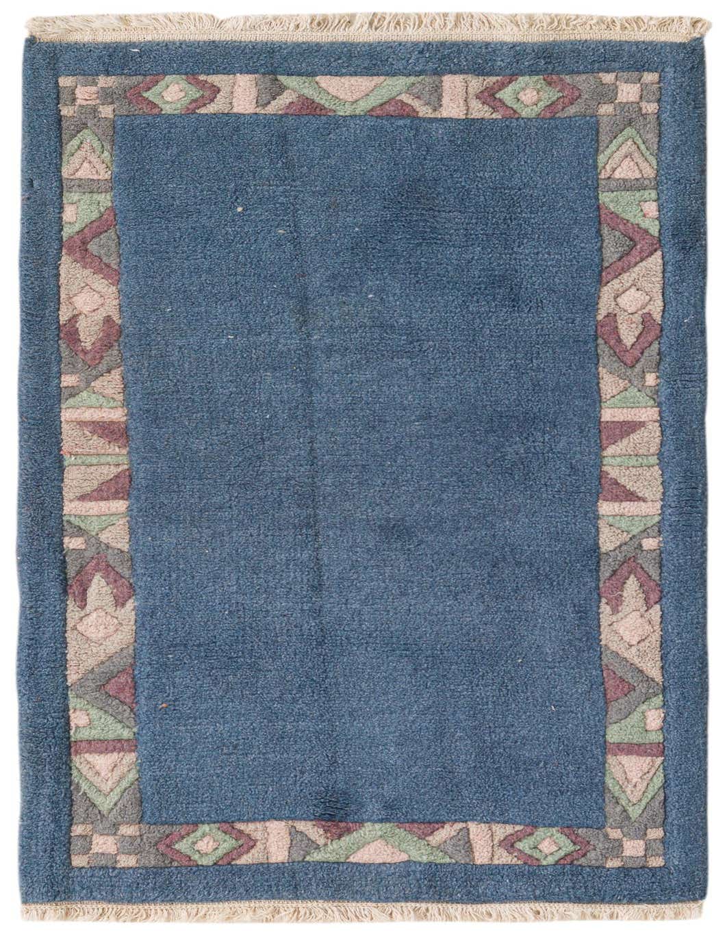 A 4 ft blue wool runner rug with a colorful African Retro border in a hallway setting.