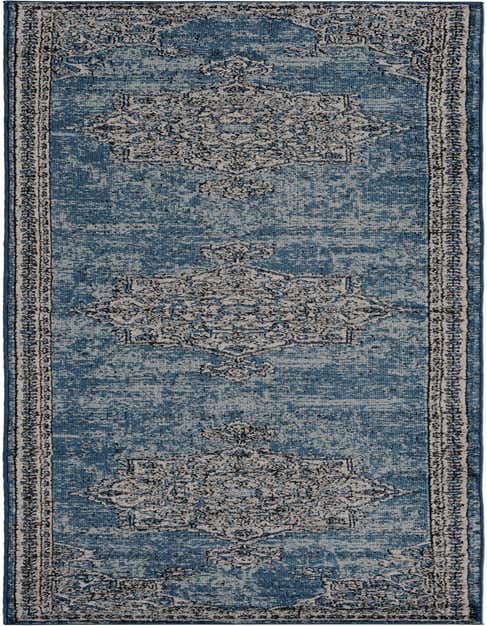 A 12 ft blue runner rug with a distressed traditional medallion pattern in shades of light blue and gray, ideal for a hallway.
