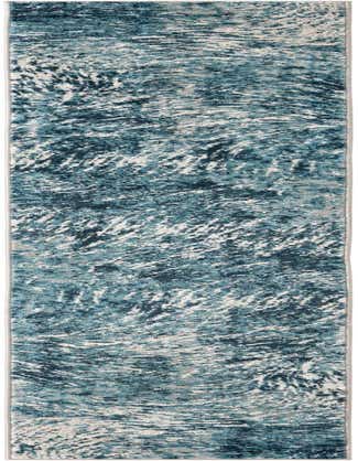 A 12 ft runner rug from the Oasis collection, featuring a modern coastal pattern in various shades of blue and white, ideal for a hallway.