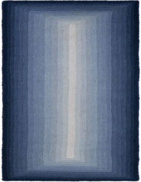A long 8 ft runner rug featuring an ombre design with shades of blue, from dark navy edges to a light blue center.