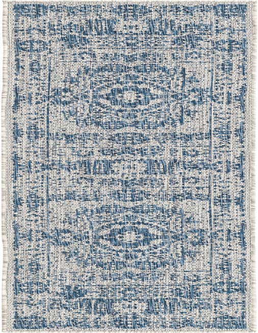 An 8 ft runner rug in shades of blue and white with a distressed Southwestern medallion pattern, suitable for indoor or outdoor use.