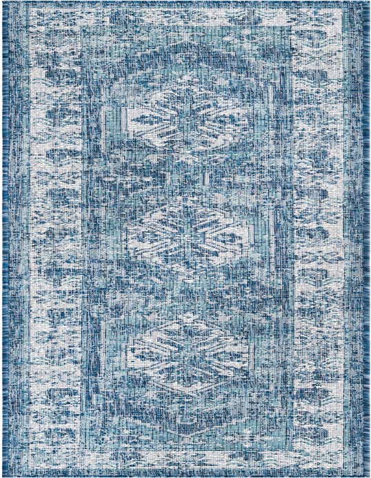 An 8 ft runner rug featuring a distressed Southwestern pattern in varying shades of blue and white, suitable for a hallway or patio.