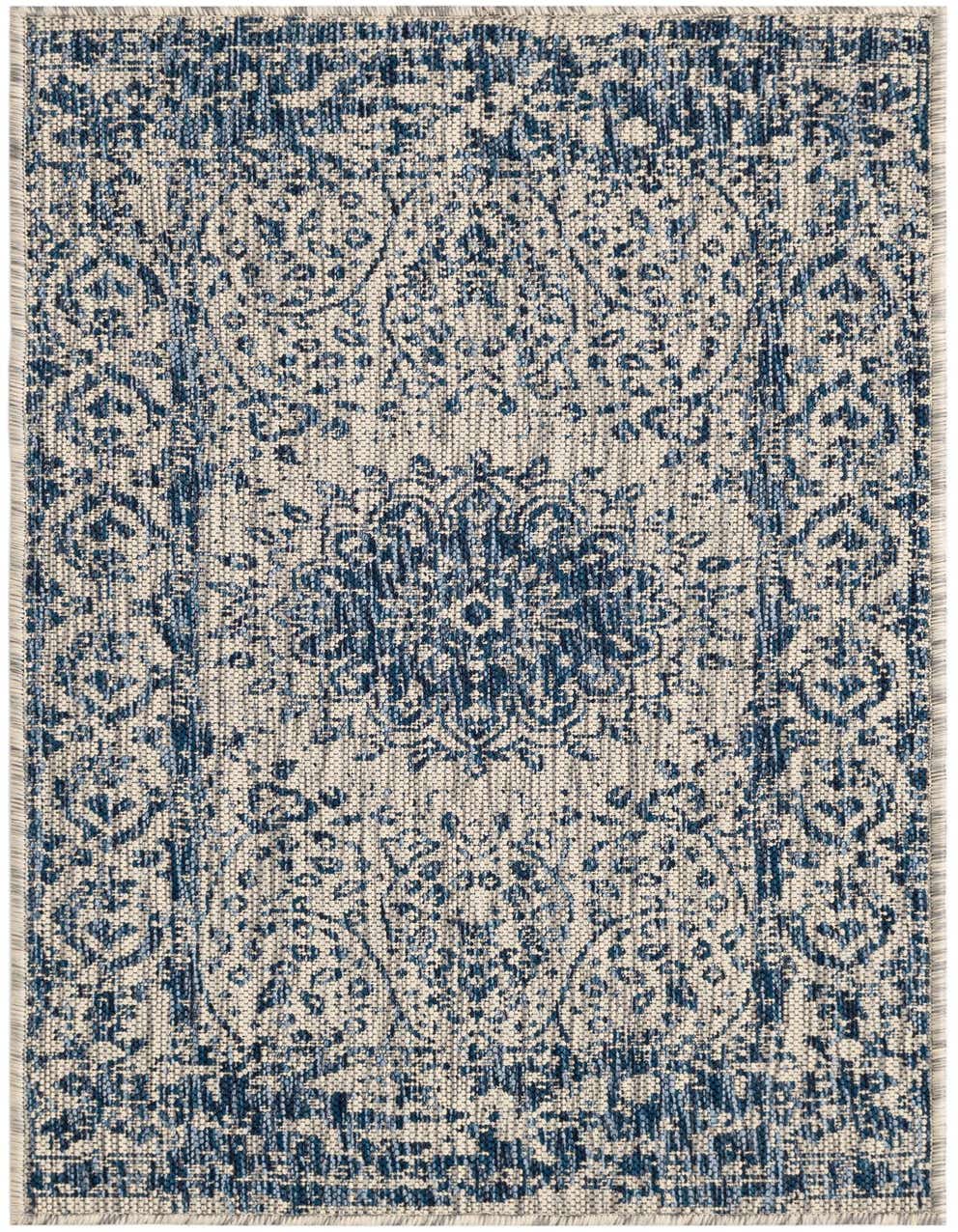 A 4 ft blue and white vintage medallion runner rug with a flatweave texture, suitable for a hallway or patio.