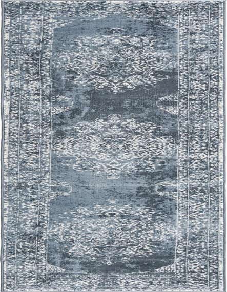 A 12 ft runner rug in shades of blue with a distressed traditional medallion and border pattern, suitable for a hallway.