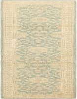 A 10 ft runner rug featuring a light blue Persian pattern on a cream background, ideal for a hallway.