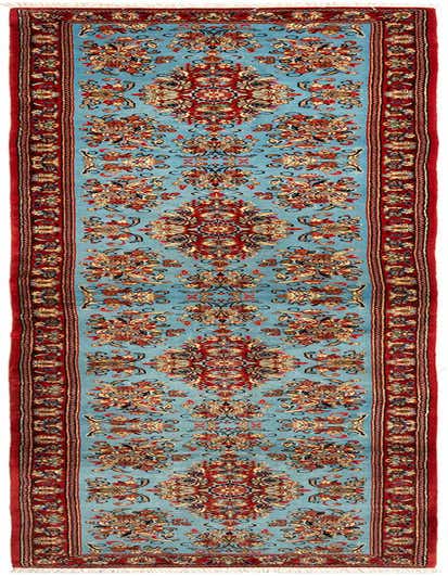 A 13 ft Qom runner rug with a light blue field and intricate red, gold, and blue Persian floral patterns, perfect for a hallway.
