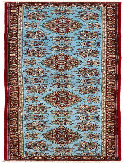 A 13 ft runner rug with a light blue field and intricate red, gold, and cream Persian floral patterns, ideal for a hallway.