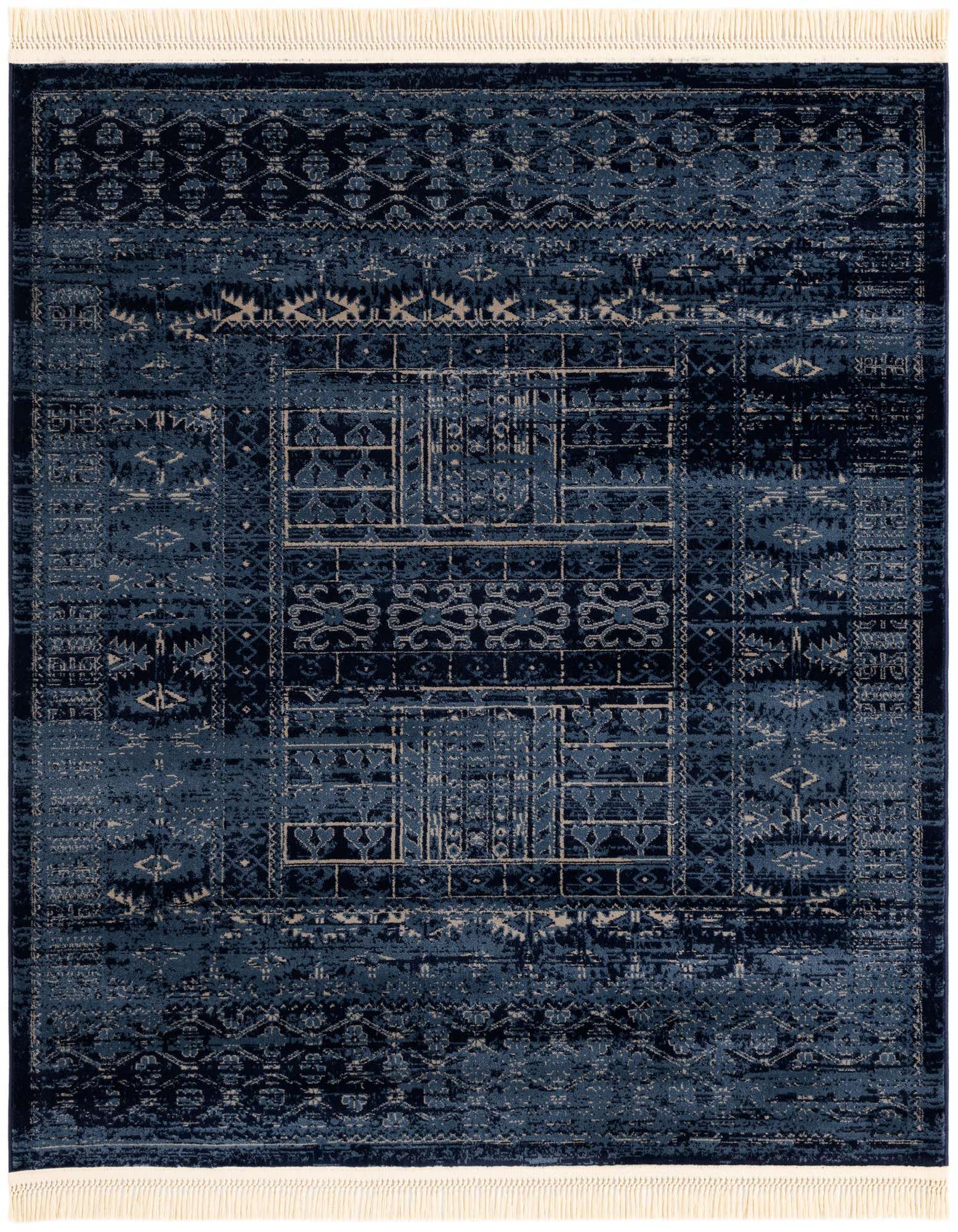 A square blue area rug with a distressed geometric pattern and light fringe, suitable for a patio or indoor space.