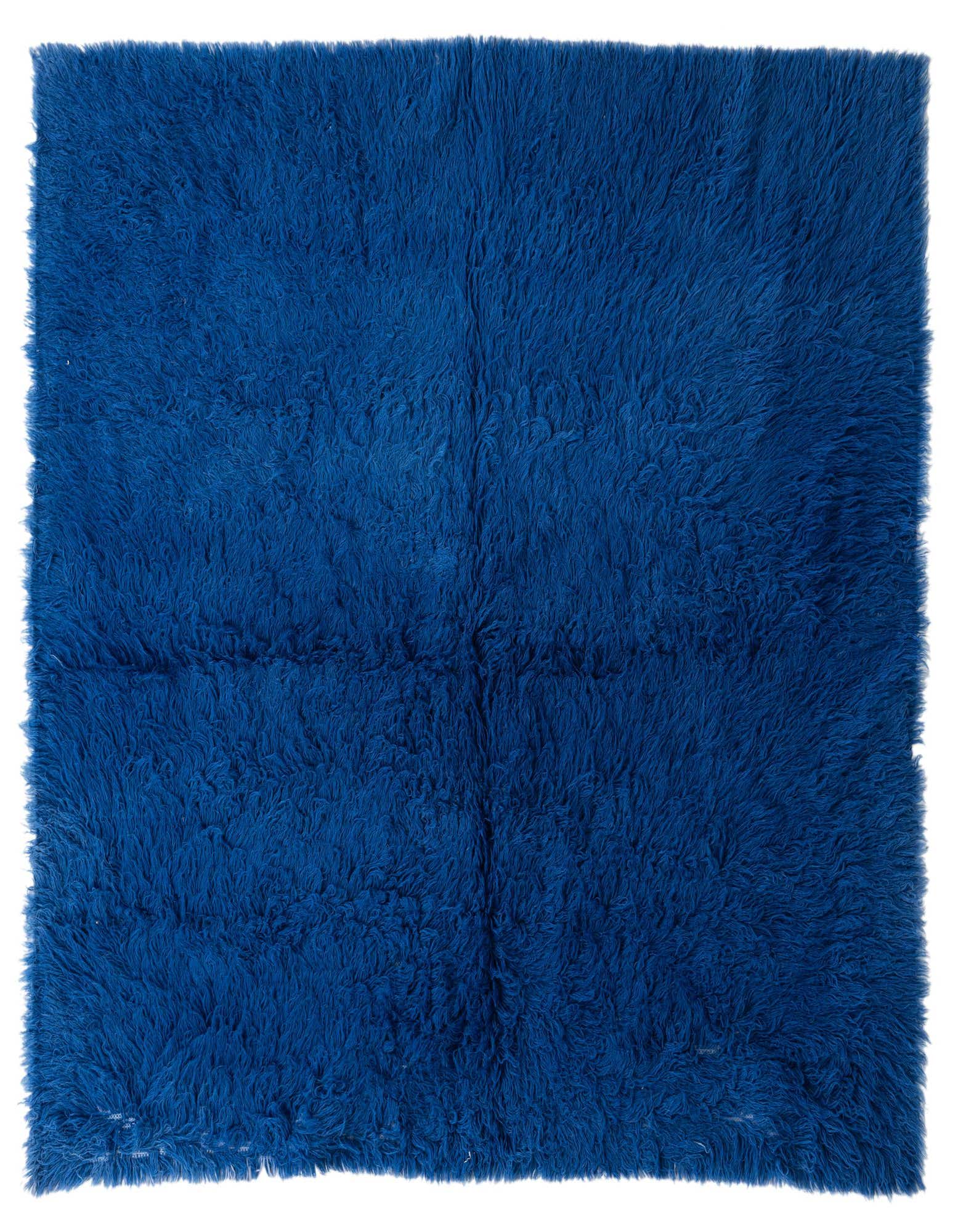 A plush, square 6' 9 x 6' 9 blue shag rug with a thick, soft pile, perfect for adding warmth to an indoor living space.