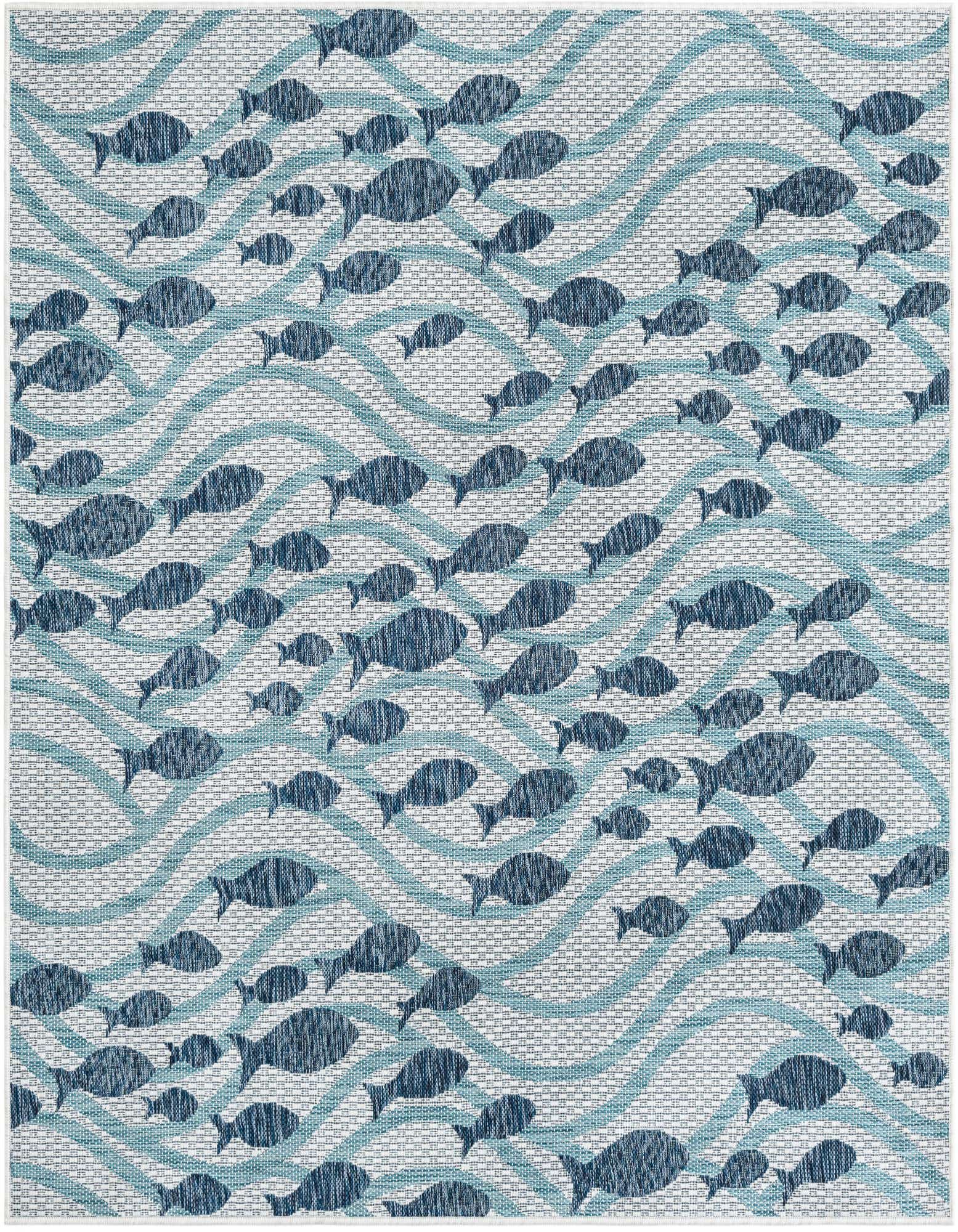 A square blue and white flatweave rug featuring a modern coastal pattern of dark blue fish swimming amidst light blue wavy lines.
