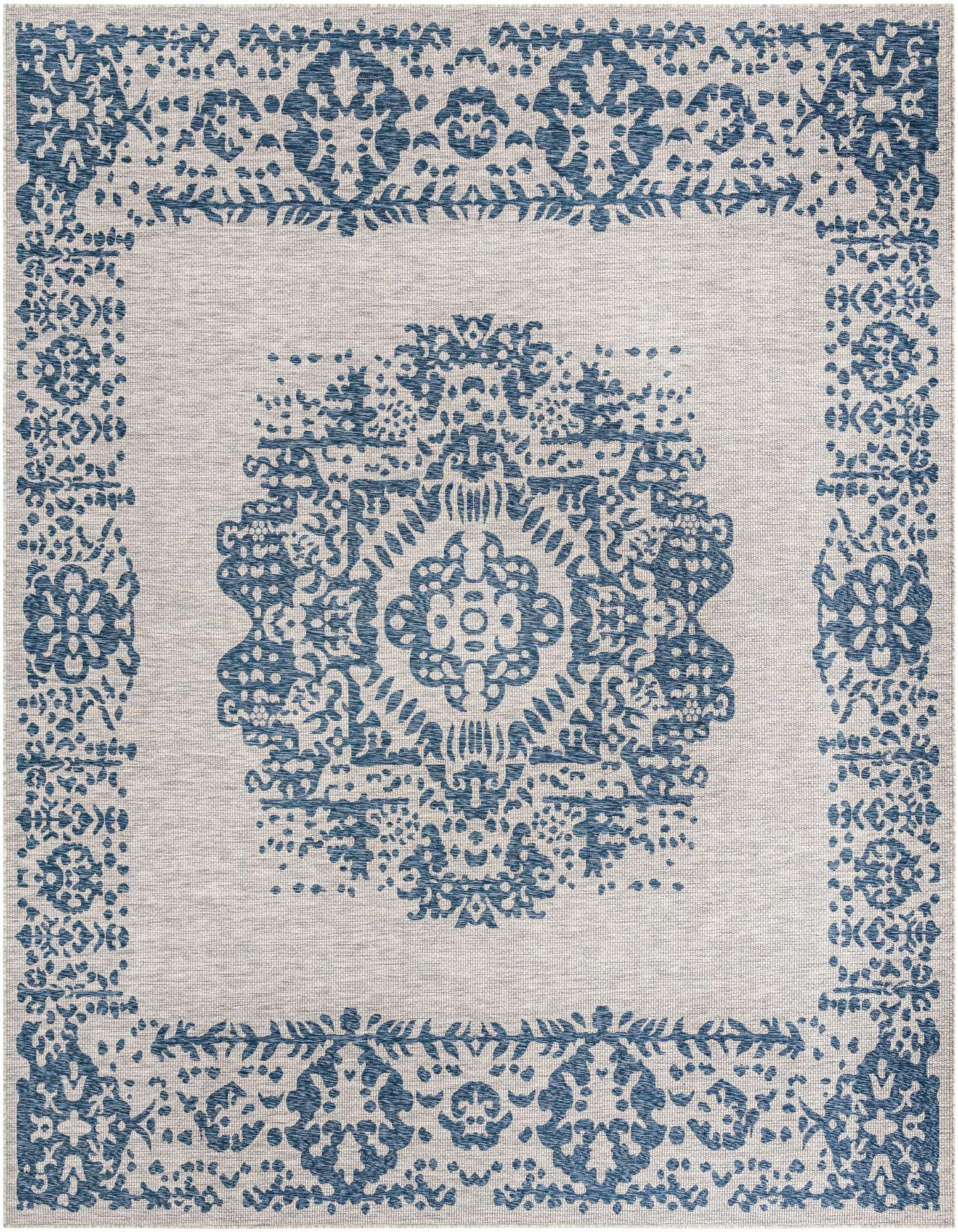 A 13' square blue and beige outdoor rug with a central medallion and traditional Southwestern patterns.