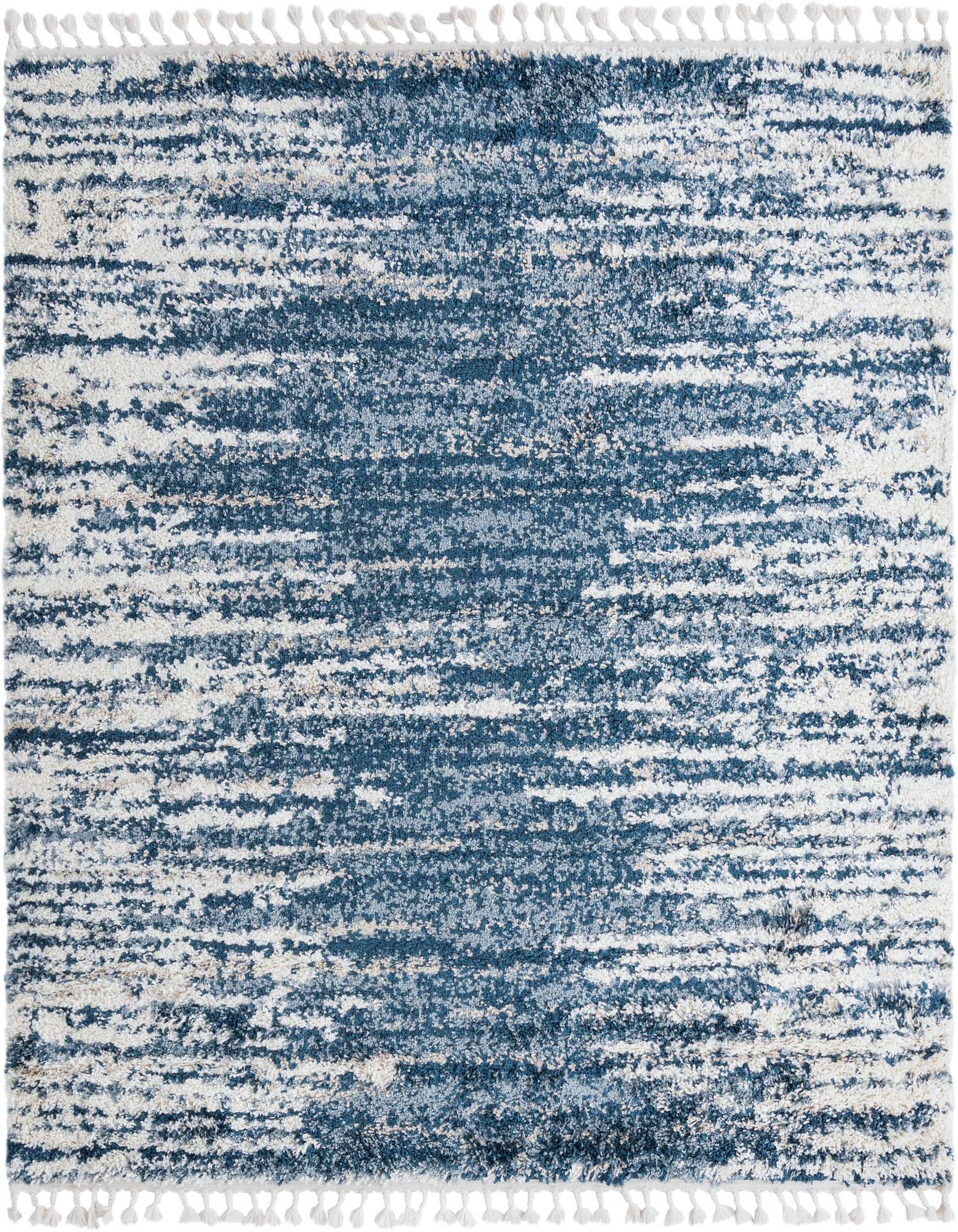 A 7' 10 x 7' 10 square blue and white shag rug with a textured, abstract striped pattern and white tassels.