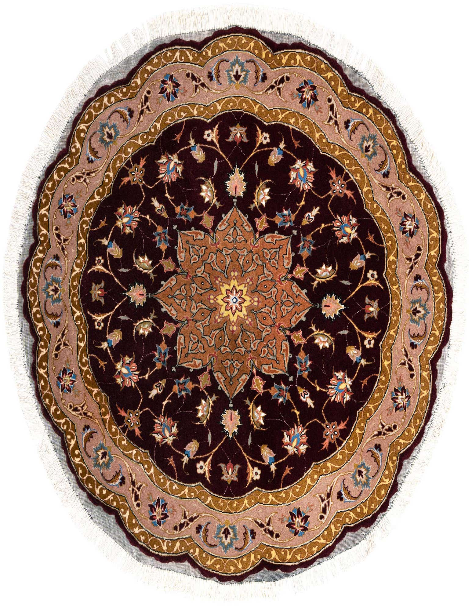 A round Bordeaux Persian Tabriz rug with a central medallion and intricate floral patterns in gold, blue, and pink.
