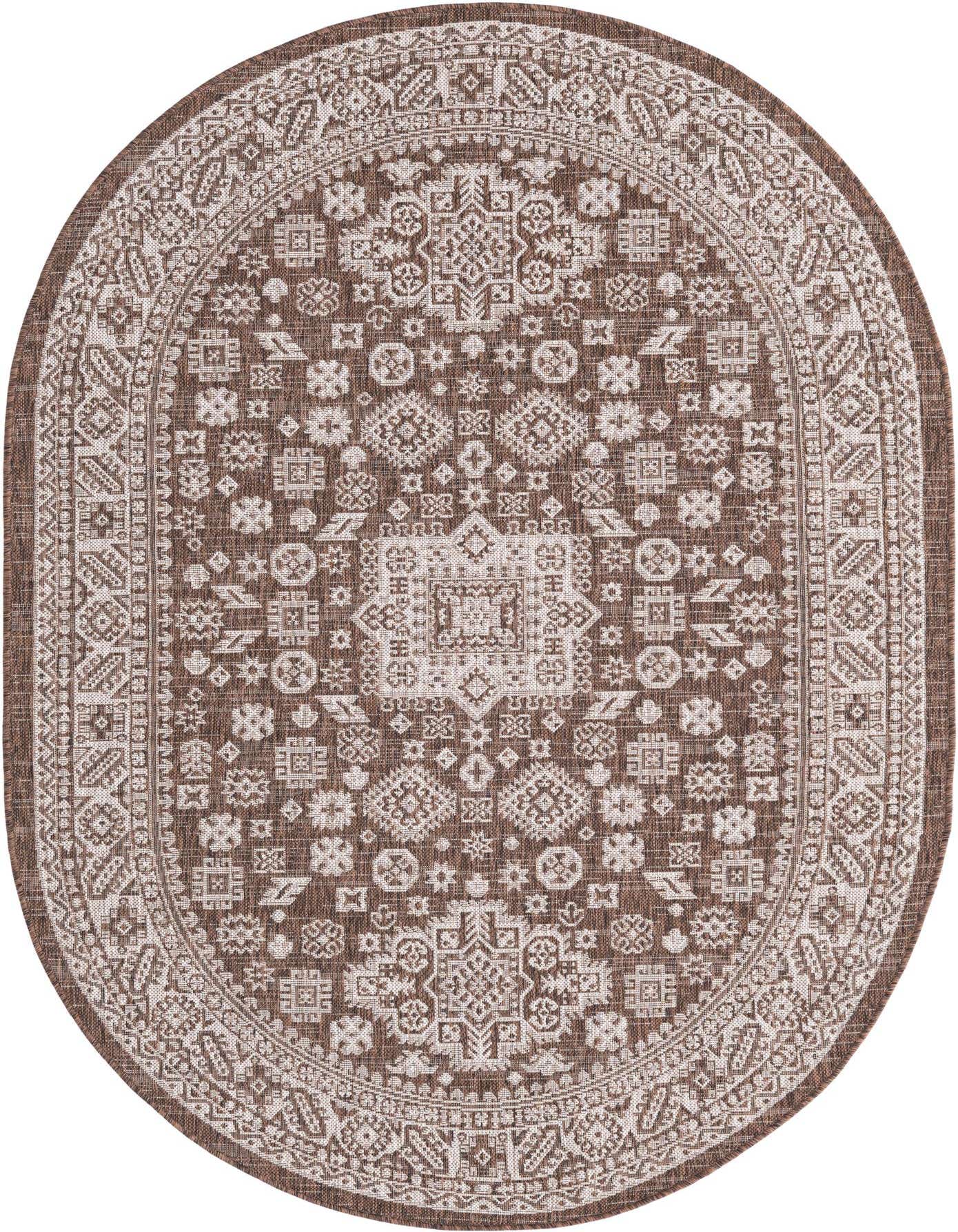 An oval 5'3" x 8'0" brown and tan Southwestern rug with a tribal pattern, suitable for indoor or outdoor use.