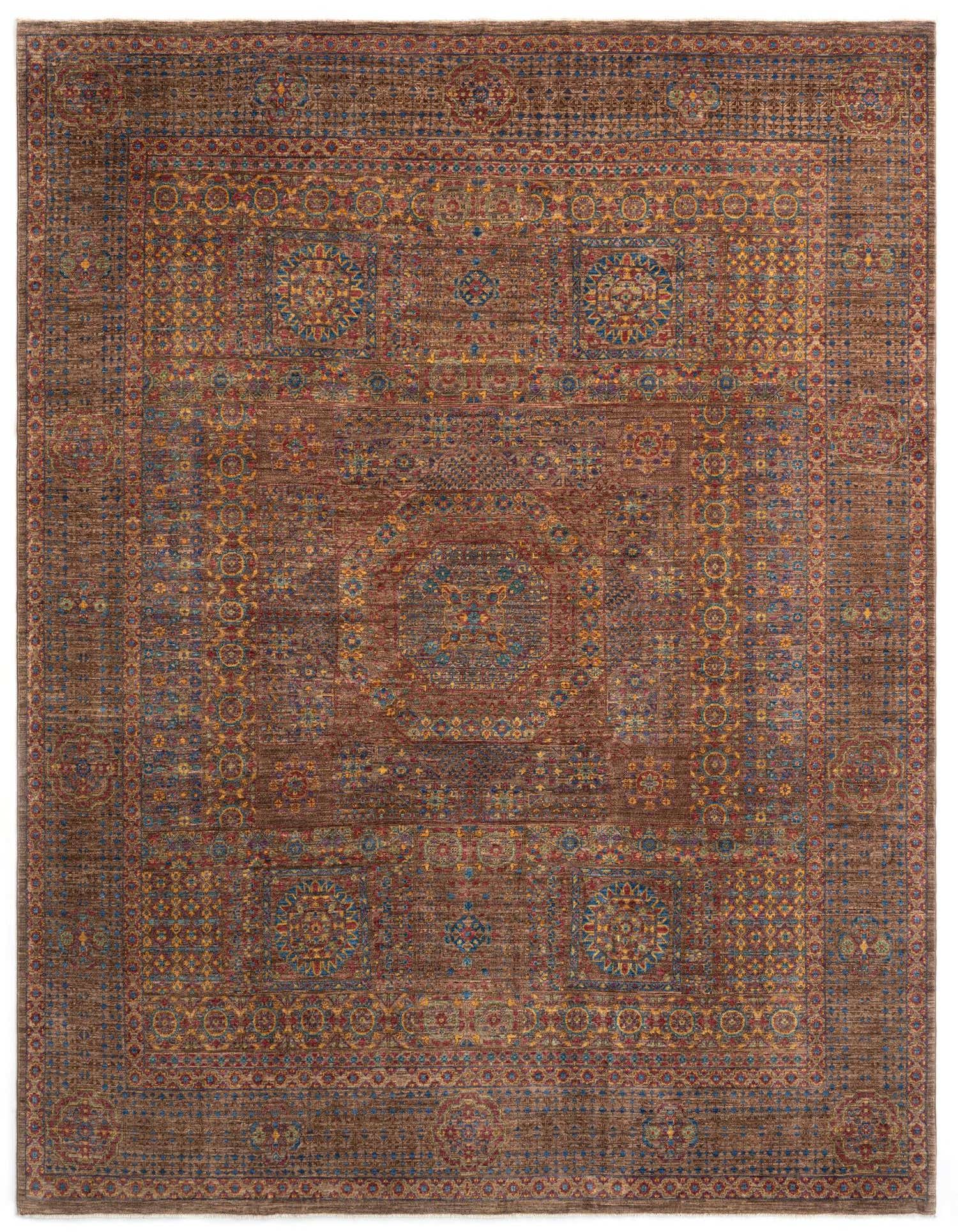 A large 8x11 rectangular Amina Persian rug in rich browns and tans with intricate traditional patterns and colorful accents.