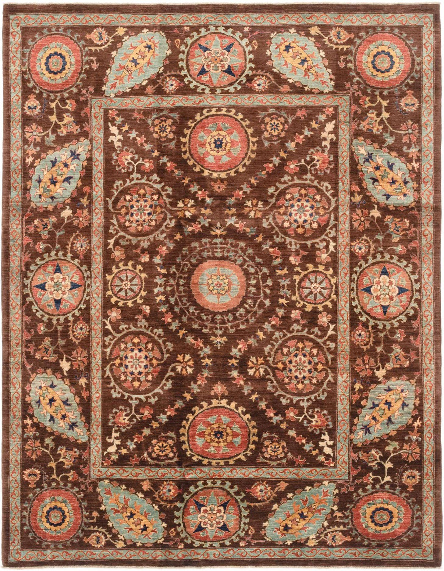 A 7x10 rectangular Ariana Ziegler rug featuring a traditional tribal pattern in browns, tans, and multi-colored medallions.