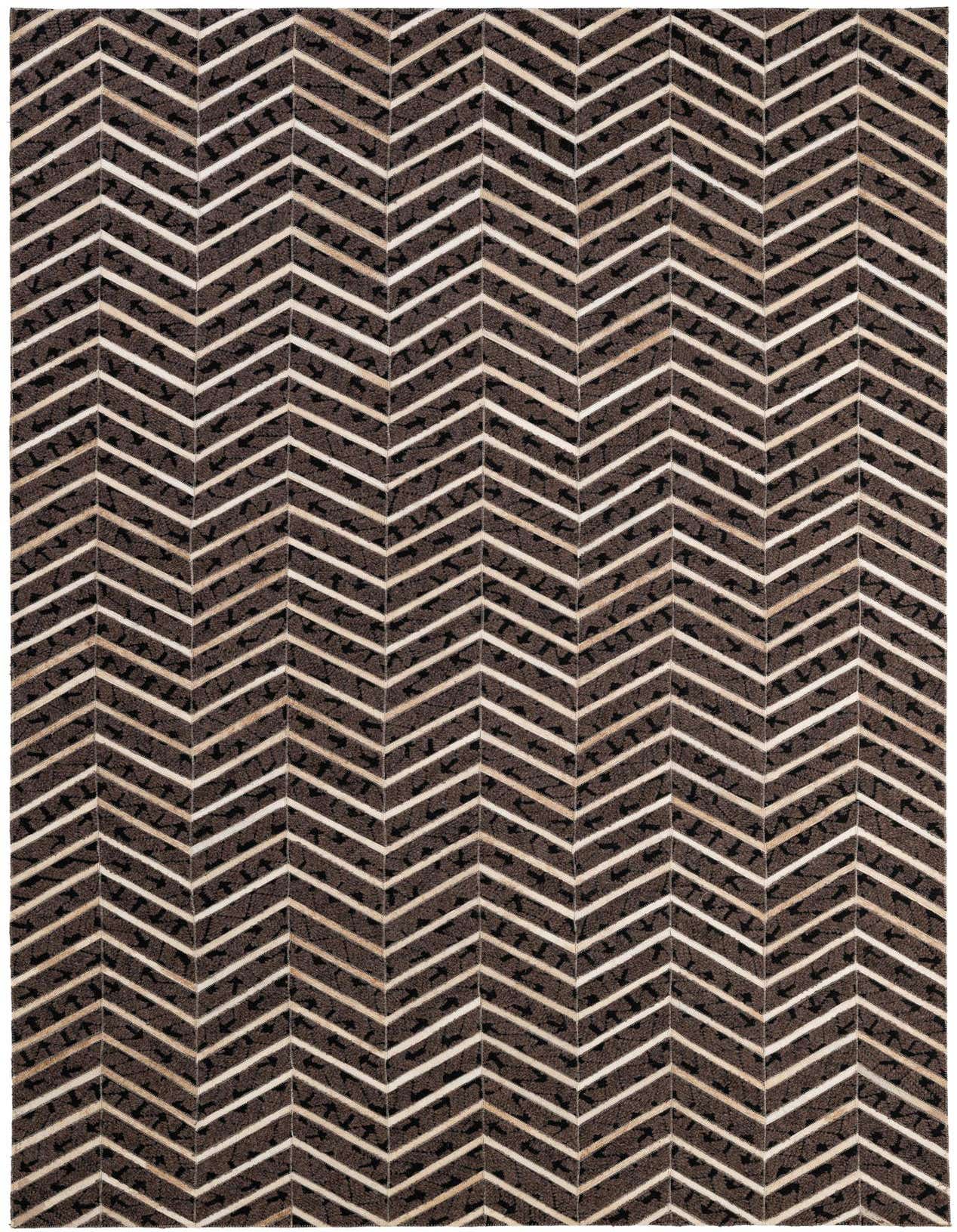A 5x8 rectangular Cowhide - Patchwork rug featuring a modern chevron pattern in varying shades of brown and tan.