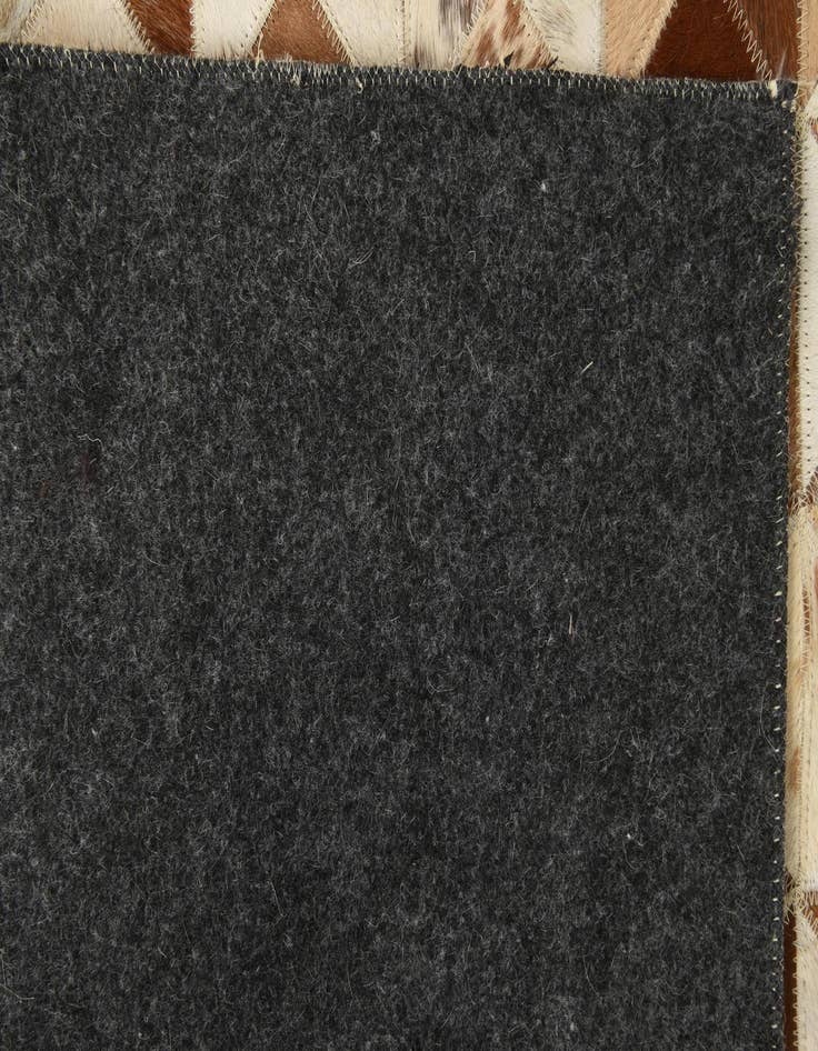 Detail image of  5' 4 x 7' 7 Cowhide Rug