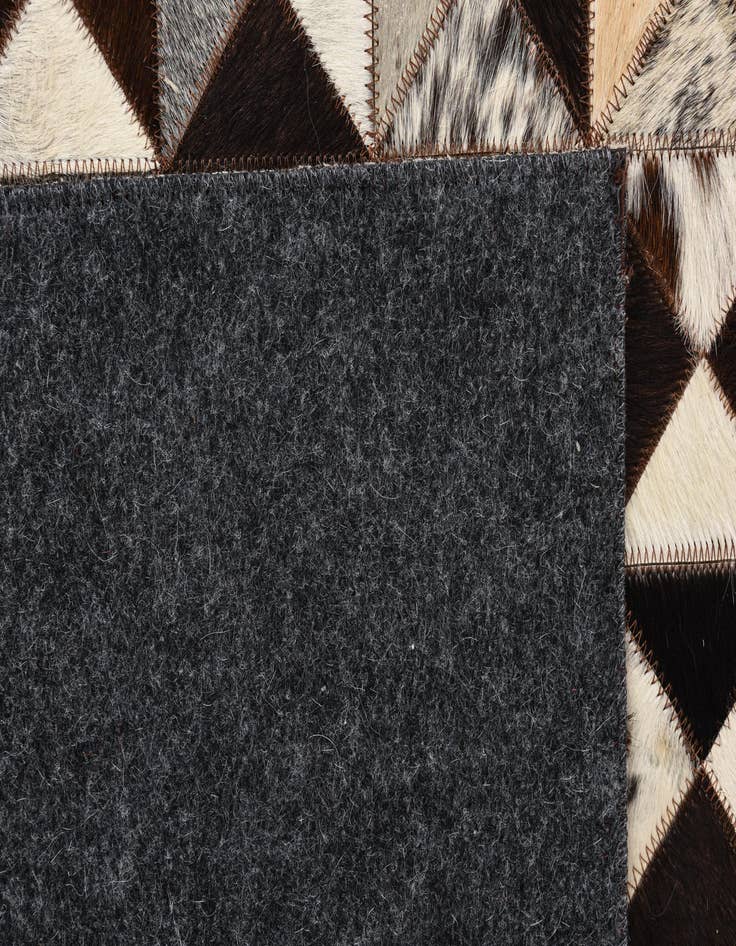 Detail image of  5' 4 x 7' 7 Cowhide Rug