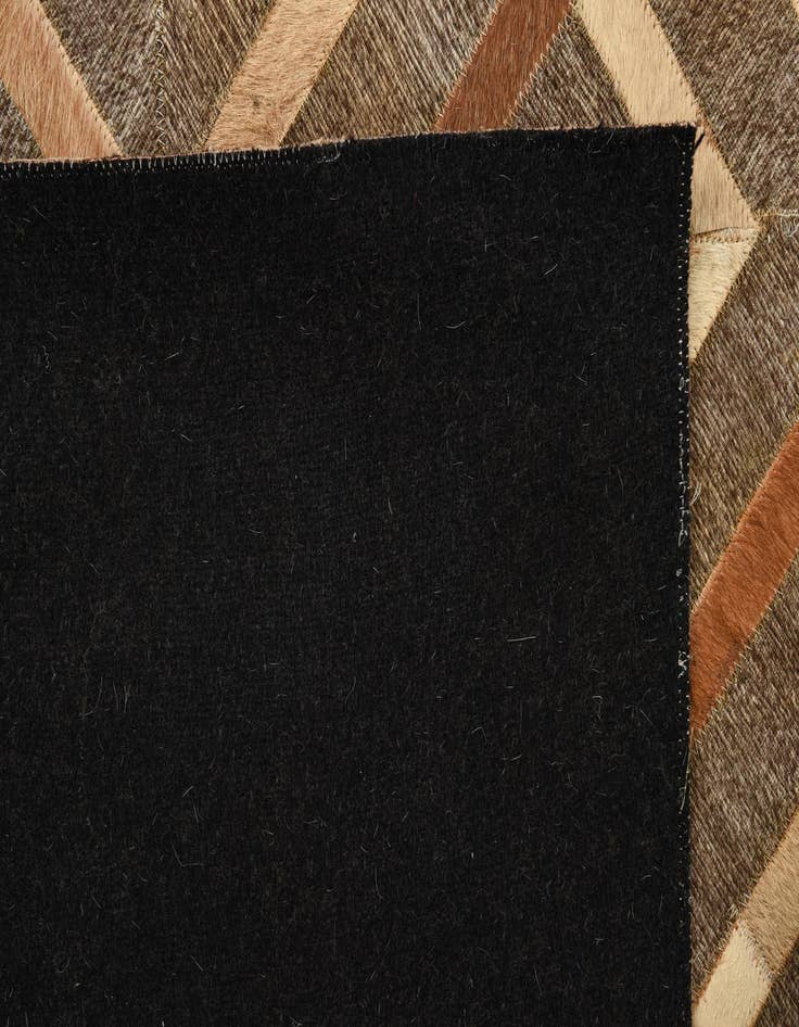 Detail image of  4' 10 x 7' 9 Cowhide Rug