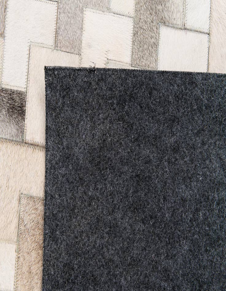 Detail image of  6' x 8' 11 Cowhide Stocks Rug
